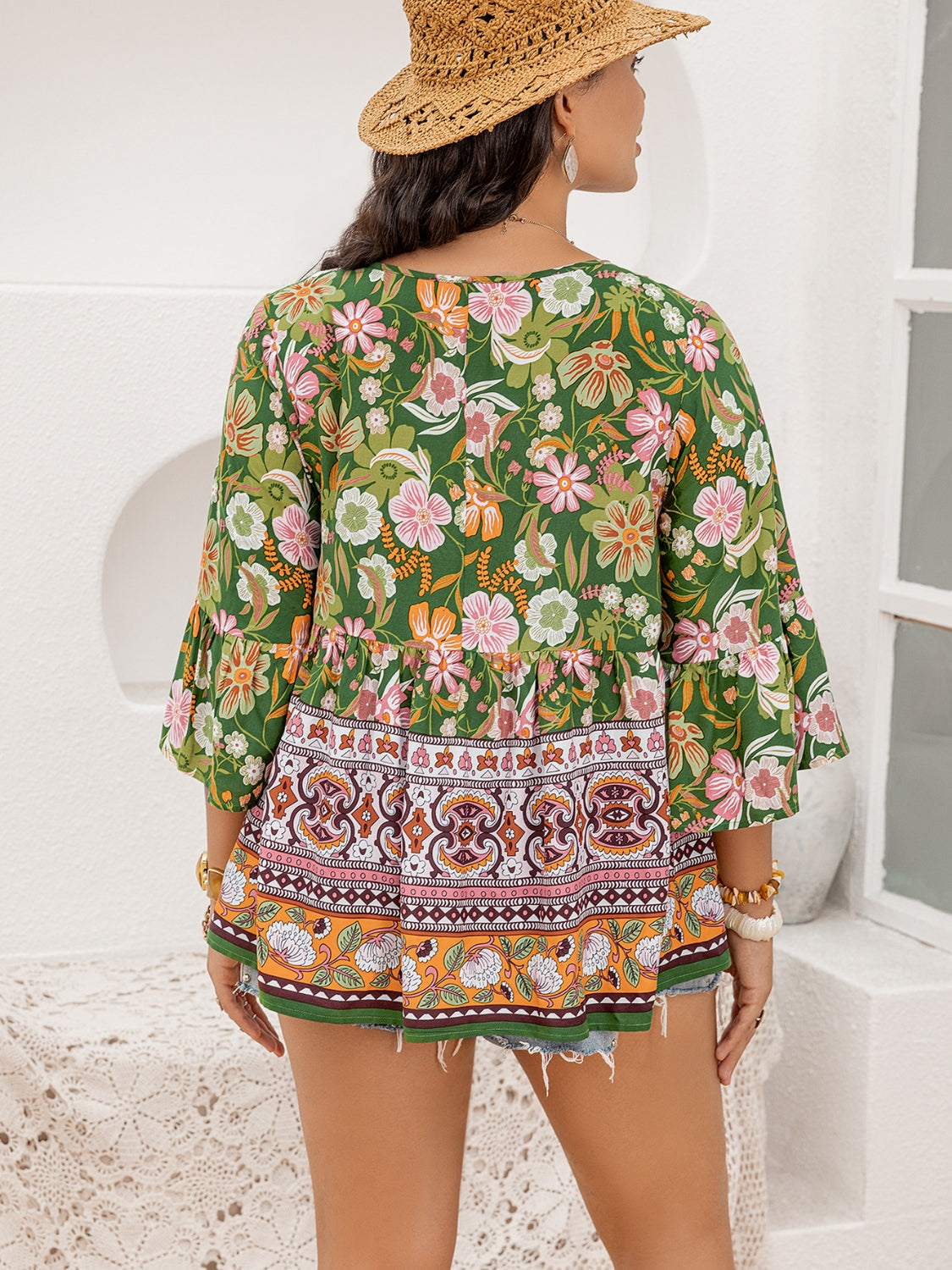 Printed Tie Neck Peplum Blouse